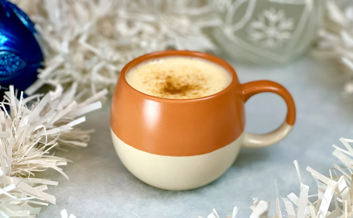 Creme Brulee Latte in a rounded mug at North Coast Café, topped with brown sugar and served as a cosy winter warmer.